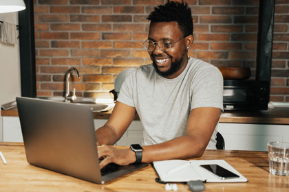 Male teacher on computer